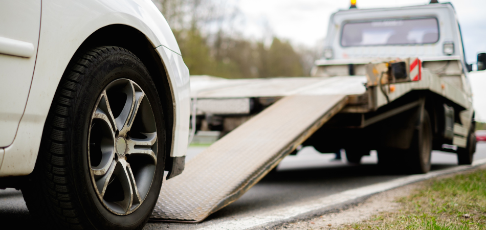 White car bout to be towed