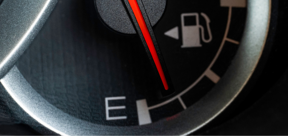 Car therometer showing gas almost empty