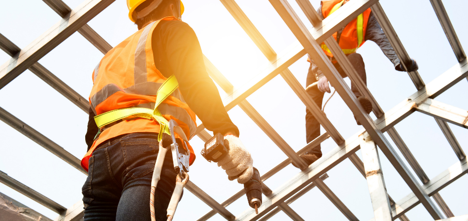 Construction workers working on framing a building